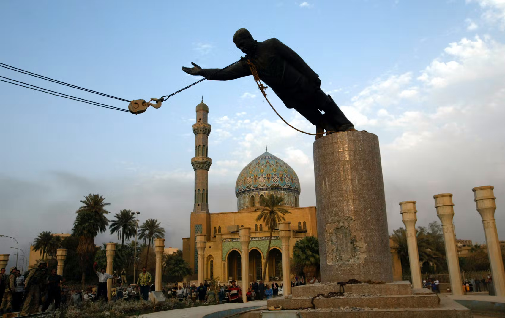 Saddam Hussein statue being toppled in Firdos Square